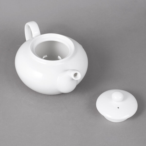 A white 10 Strawberry Street teapot with a lid.