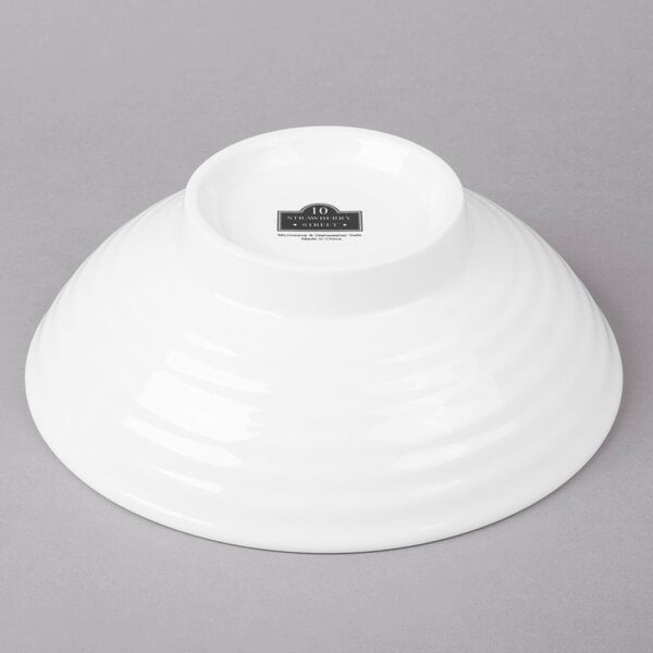 A white 10 Strawberry Street Whittier ribbed footed pho bowl on a gray background.
