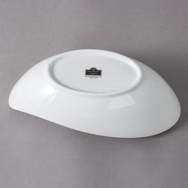 A white 10 Strawberry Street Whittier porcelain canoe bowl.