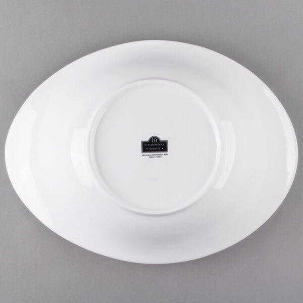A white porcelain serving bowl with a black label.