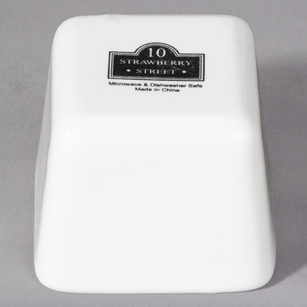 A white square porcelain bowl with black text that reads "10 Strawberry Street" 