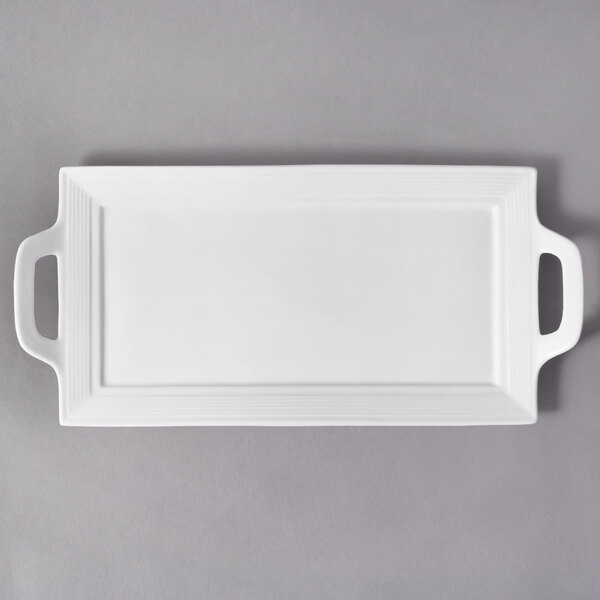 A white rectangular porcelain platter with handles.