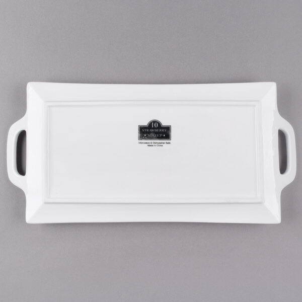 A white rectangular porcelain platter with handles.
