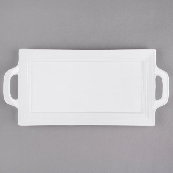 A white rectangular porcelain platter with handles.