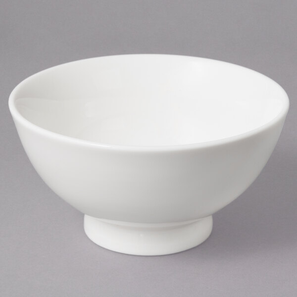 A close up of a 10 Strawberry Street Whittier white porcelain footed bowl.