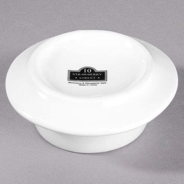 A white porcelain bowl with a black logo reading "Whittier" on it.