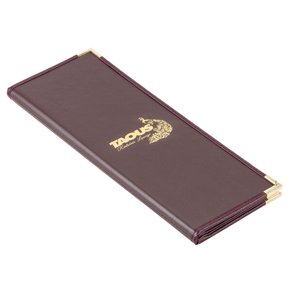 A brown leather-like Menu Solutions Royal Select menu cover with gold trim.
