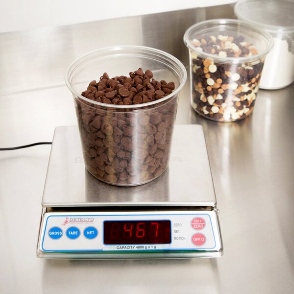 a container of chocolate chips on a scale