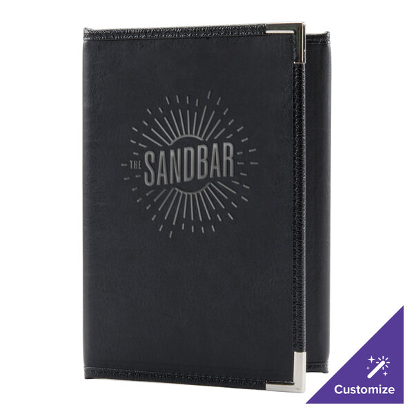 A black leather Menu Solutions Royal Select menu cover on a counter.