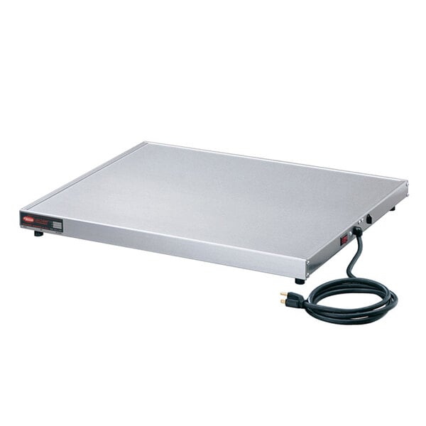 A white rectangular stainless steel Hatco heated shelf with a cord.