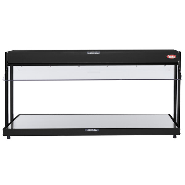 A black Hatco countertop buffet warmer with glass shelves.