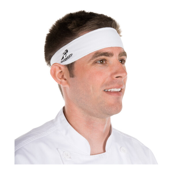 A man wearing a white headband with a small logo on the side, dressed in a white buttoned shirt.