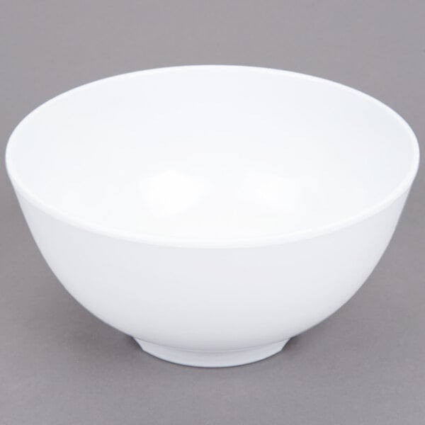 A white GET Water Lily melamine bowl on a gray surface.