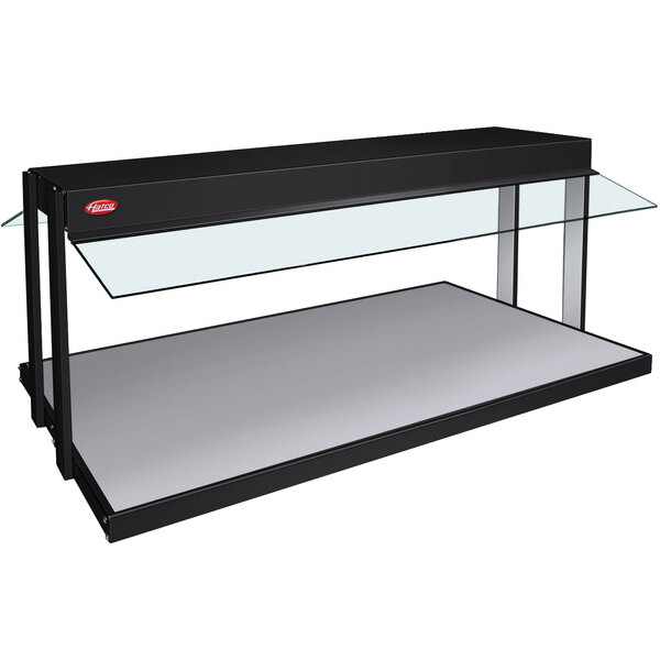 A black Hatco countertop buffet warmer with glass shelves.