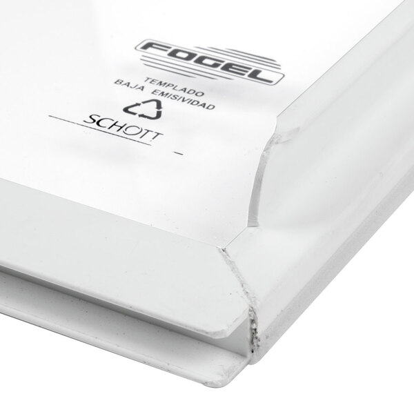 A close up of a white plastic sliding bottom lid with the word "Excellence" on it.