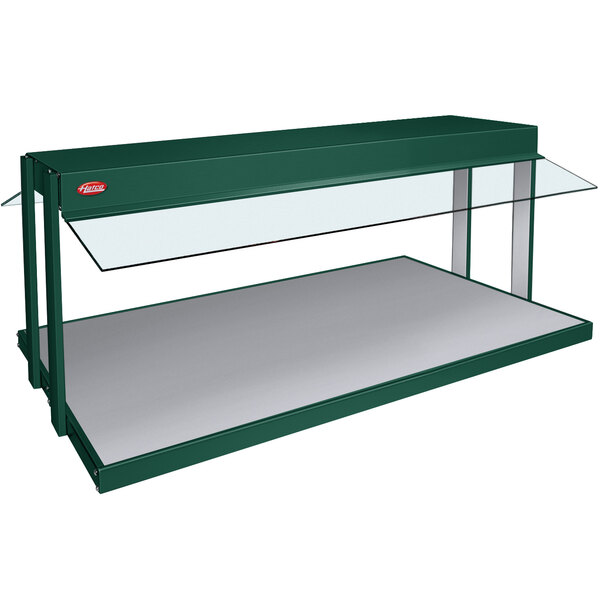 A green buffet warmer with glass shelves.