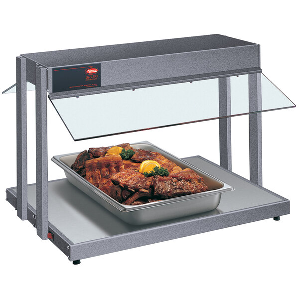 A Hatco countertop buffet warmer with a tray of meat.