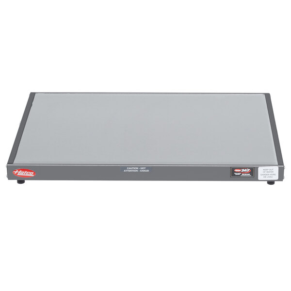 A grey rectangular Hatco heated shelf warmer with a black border.
