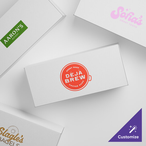 A group of 8 7/8" x 3 3/4" x 2 3/8" white customizable candy boxes with different designs.