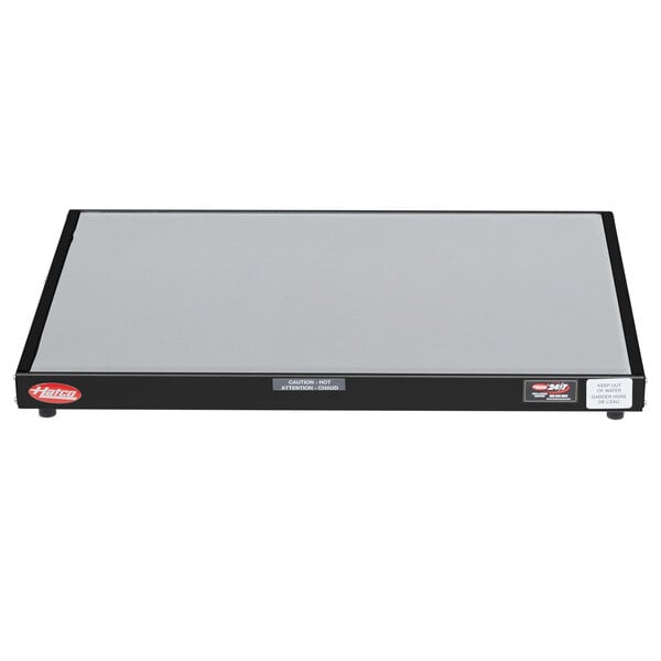 A grey rectangular Hatco heated shelf warmer with a black border.