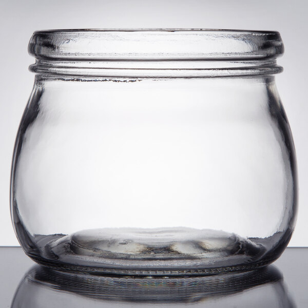 An American Metalcraft clear glass Mason jar with a lid on a white background.