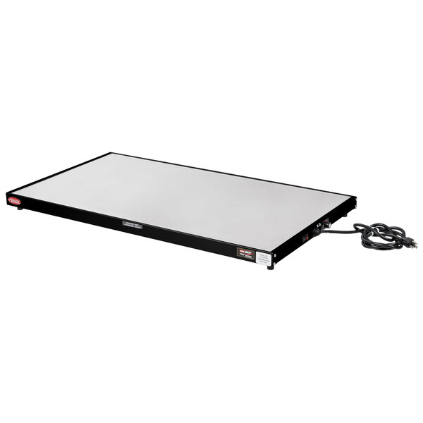 A white rectangular Hatco heated shelf with black wires.