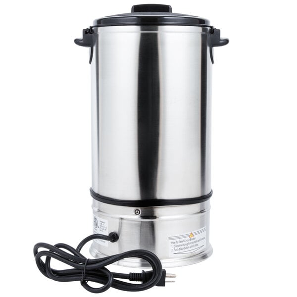 A stainless steel Town water boiler with a black lid and cord.
