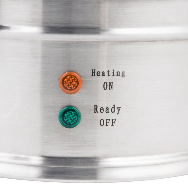 A Town stainless steel water boiler with a green and red circular button.