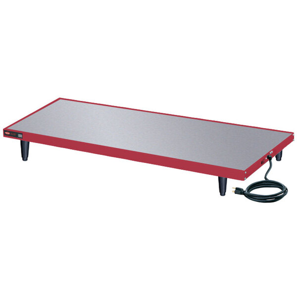 A rectangular metal Hatco heated shelf warmer with a cord attached.