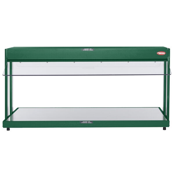 A green Hatco countertop buffet warmer with glass shelves.