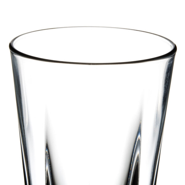 A close up of a Libbey Inverness beverage glass with a clear liquid inside.