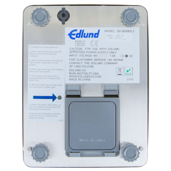 An Edlund Poseidon waterproof digital portion scale in a box with a white label.