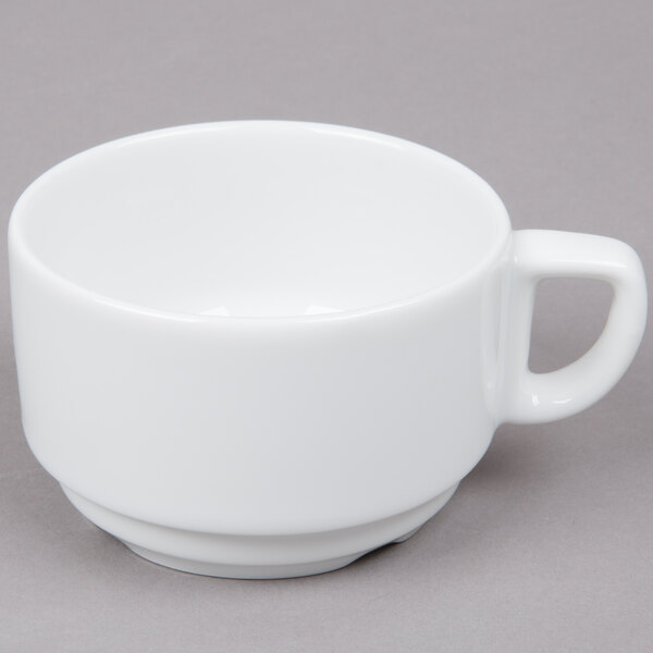 An Arcoroc white porcelain cup with a handle.