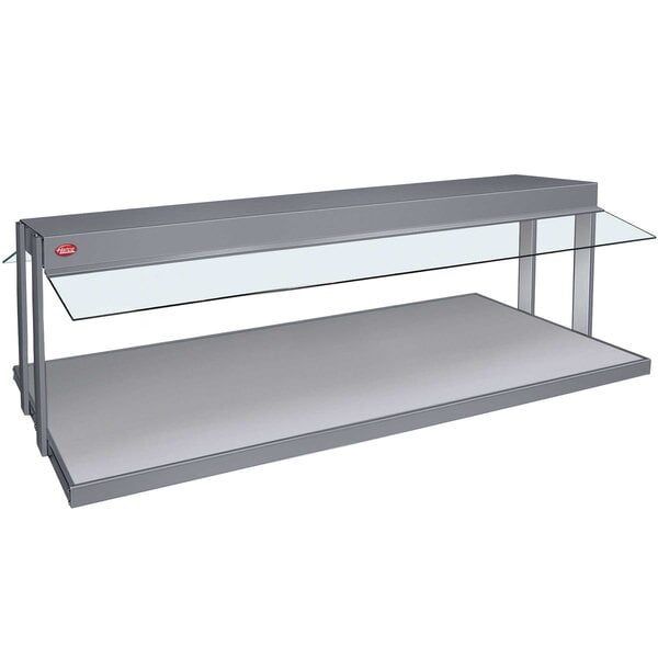 A Hatco countertop buffet warmer with a glass top over a grey granite shelf.