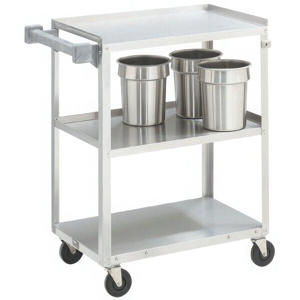 A Vollrath stainless steel utility cart with two silver containers on it.