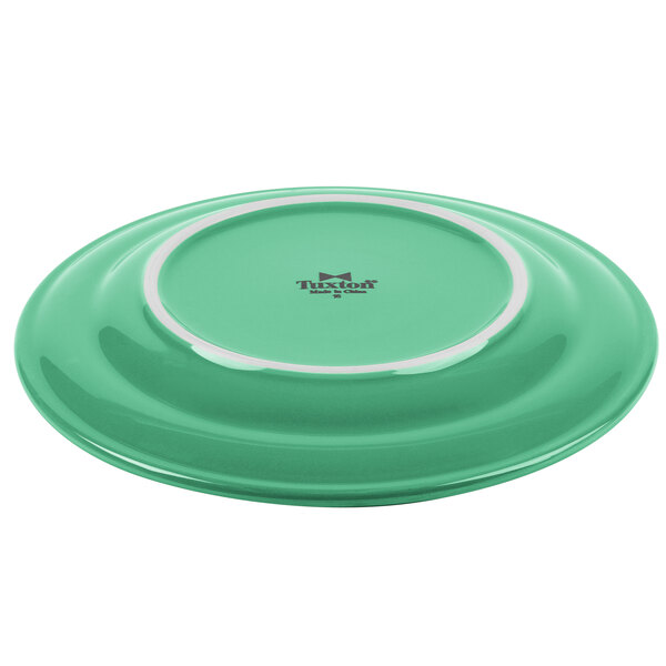 A green plate with a white rim.