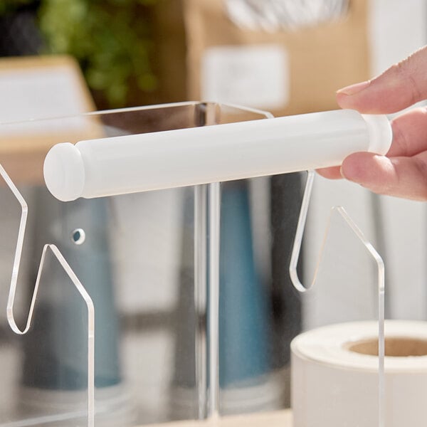 A white plastic replacement roller for a label dispenser.