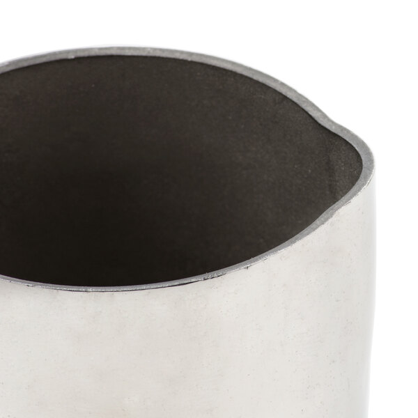 An American Metalcraft stainless steel creamer with a hammered texture.