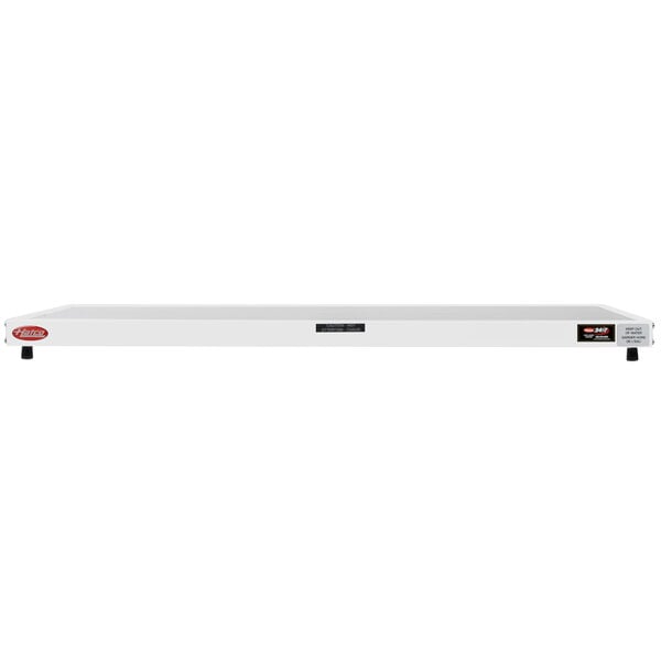 A white Hatco rectangular heated shelf with black wheels and a red handle.