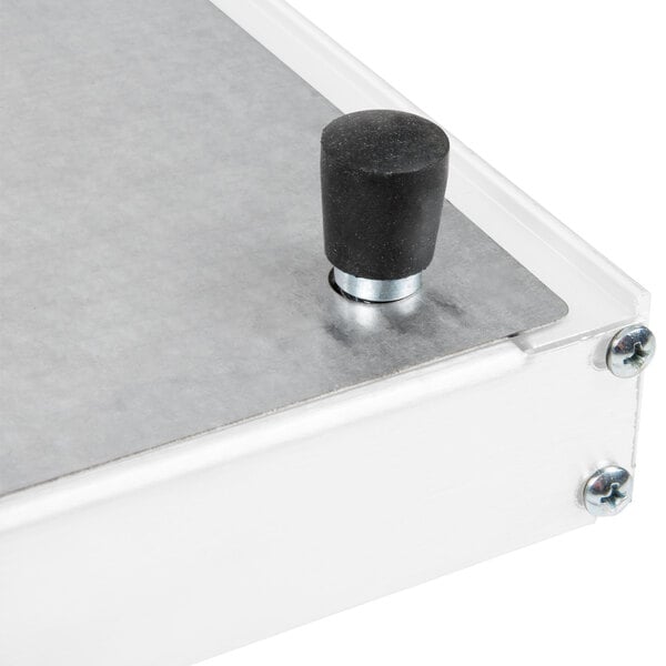 A close up of a metal Hatco heated shelf warmer with a black cap on top.