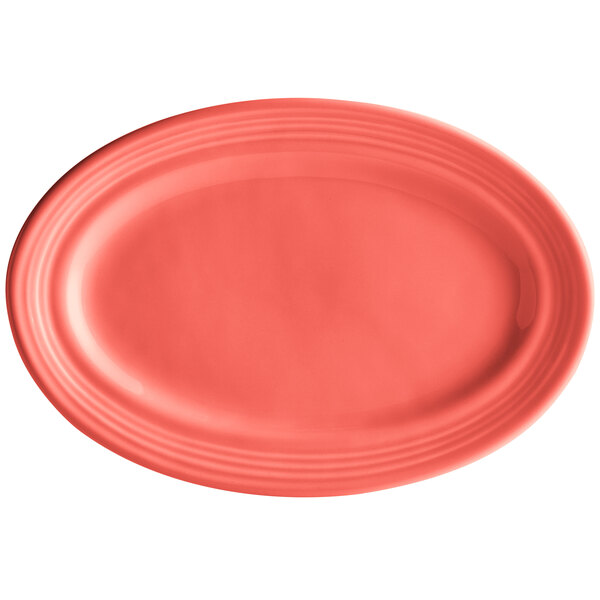 A red Tuxton oval china platter with a white background.