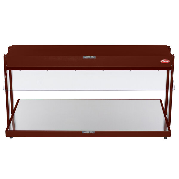 A red metal Hatco buffet warmer with glass shelves on a table.