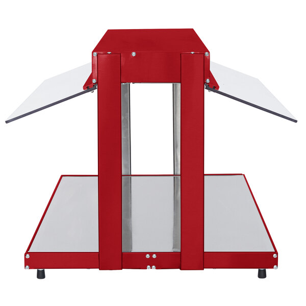 A red metal Hatco countertop buffet warmer with glass shelves.