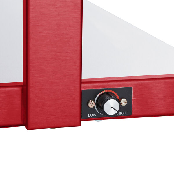 A red and white Hatco Glo-Ray buffet warmer with thermostatic controls on a counter.