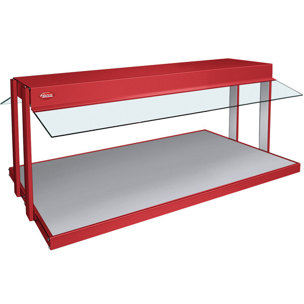 A red Hatco countertop buffet warmer with glass shelves.