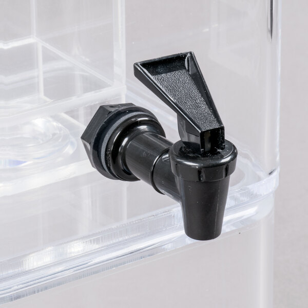 A clear plastic beverage dispenser with a black spigot and black side handles.