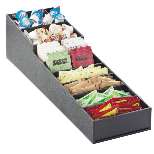 A black stackable container with different types of condiments inside.
