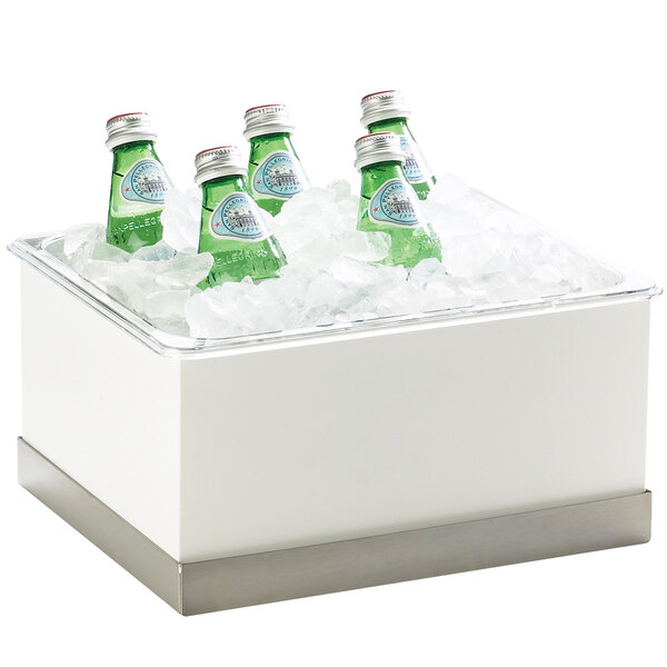 A group of green water bottles in a white Cal-Mil ice box with clear pan over ice.