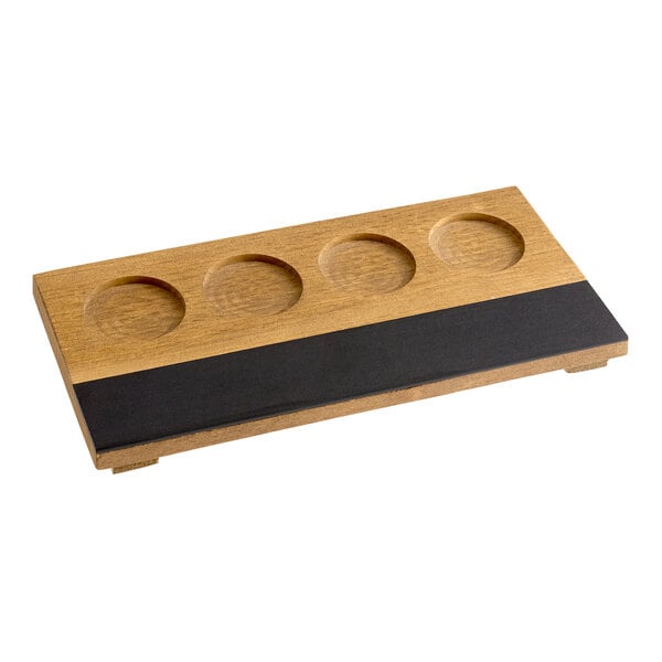 A rectangular wooden flight tray with four circular indentations and a black write-on surface.