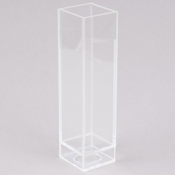 A clear rectangular stainless steel beverage dispenser with a hole in the middle.